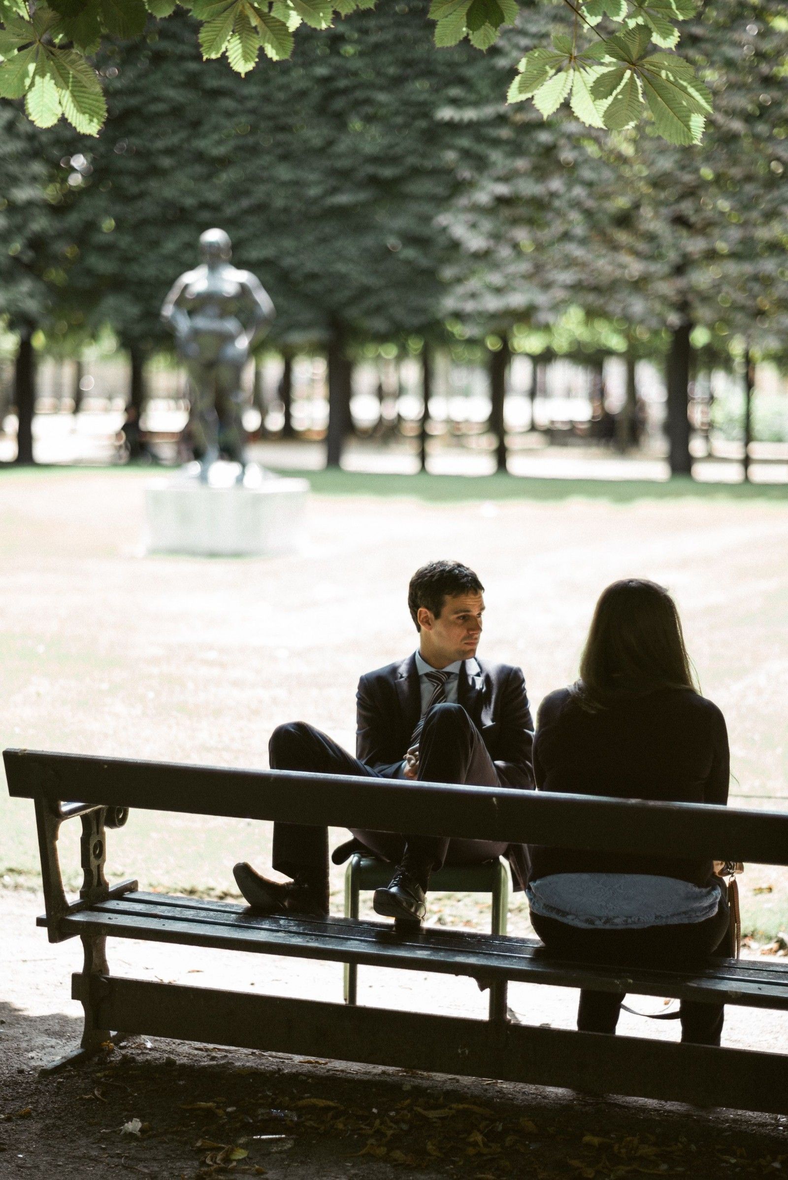 A young man together with a young woman in the park.